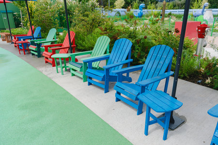 Colorful Adirondack Chairs in a Park Setting