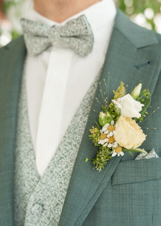 Elegant Groom Suit with Floral Boutonniere Closeの写真素材