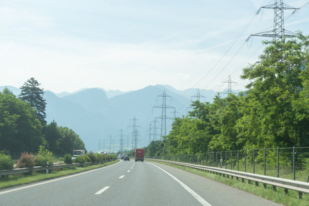Modern highway with truck and power lines inの写真素材