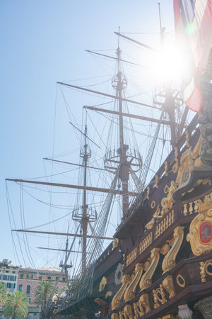 Historic sailing ship with tall masts under brightの写真素材