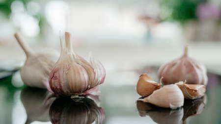 Fresh Garlic Bulbs on Black Surfaceの写真素材