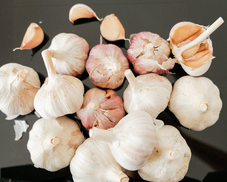 Fresh garlic with peel fragments aromatic spiceの写真素材