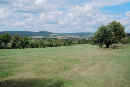 Scenic Countryside Landscape under Bright Skiesの写真素材