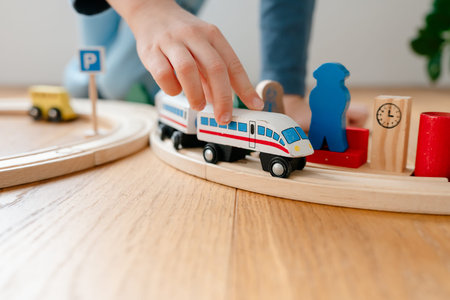 Wooden railway toy photographed in modern interiorの写真素材