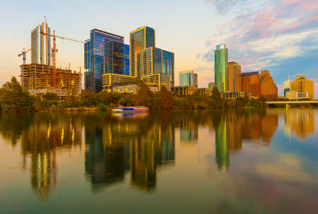 Austin, Texas with new buildings rising, reflecting in lady Bird Lake during sunset / Austin Skyline and new constructionsのeditorial素材