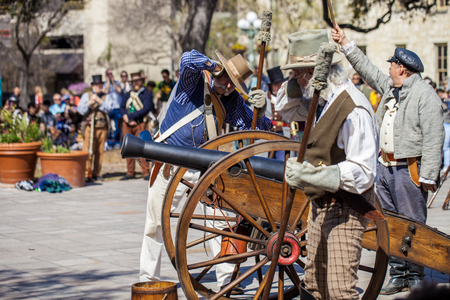 SAN ANTONIO, TEXAS - MARCH 2, 2018 - Men dressed as 19th century soldiers fire antique cannon for the reenactment of the Battle of the Alamo, which took place between February 23 and March 6, 1836のeditorial素材