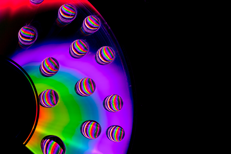 Patterns of light and color created by water drops refracting light/abstract background with rainbow colors and copy spaceの写真素材