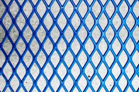 Closeup of welded chain link blue metal fenceの写真素材