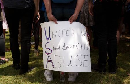 AUSTIN, TEXAS - JULY 2, 2019 - People protesting against President Donald Trump and border camps. Different demands written on pancards.のeditorial素材