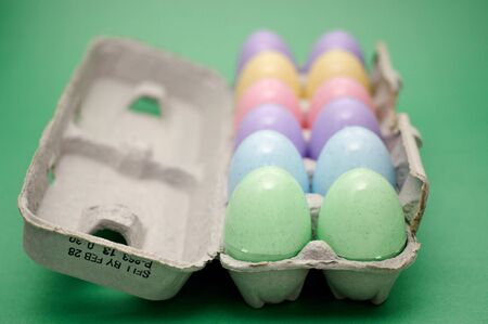 A tray of colorful easter eggs ready for the hunt.の写真素材