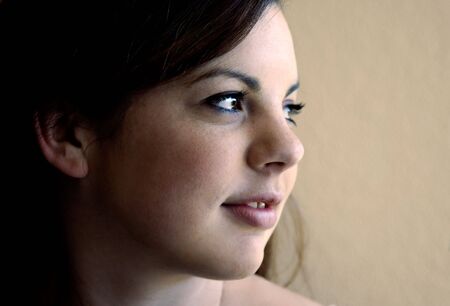 A smiling teenager looks off to the right.の写真素材