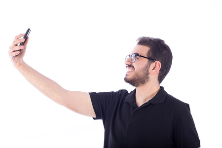 Young man taking selfie - isolated on white