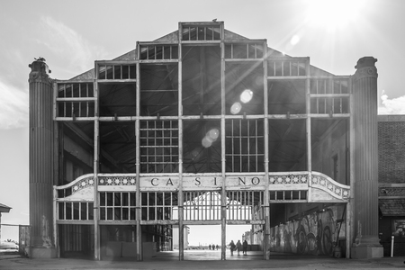 The famous Casino in Asbury Park, New Jersey at the Jersey Shore; a boardwalk landmark; horizontal format, black and white image, sun flare streaming over the structureのeditorial素材