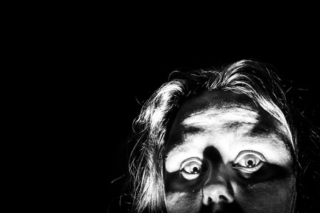 A woman peeks out from the corner of a picture as if she is checking to see if it is safe to come...