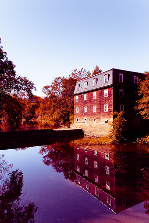 Old mill reflected on waterのeditorial素材