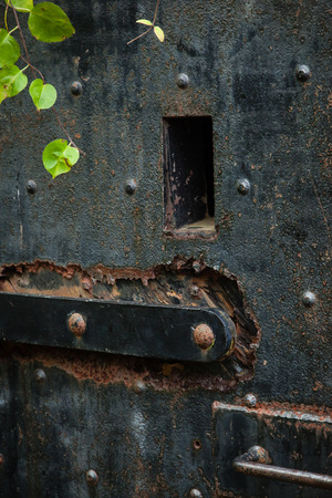 Old iron door at military baseの写真素材