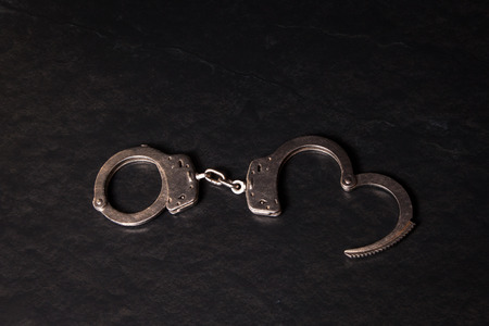 Handcuffs on a black background.