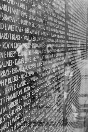 Washington DC - December 6, 2015:  Reflections of visitors seen on the Vietnam Veterans Memorialのeditorial素材
