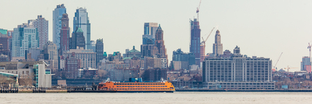 JERSEY CITY, NJ - MARCH 6: The Staten Island Ferry is docked at it's Lower Manhattan terminal on March 6, 2016.  Photo taken from Liberty State Park.のeditorial素材