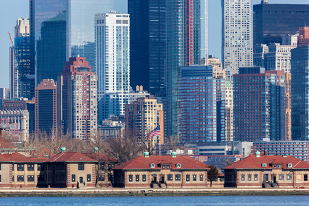 A closeup of Lower Manhattan's Financial District seen behind Ellis Island. Photo taken on March 6, 2016.のeditorial素材