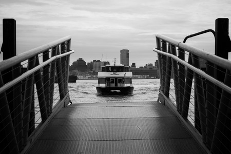 APRIL 11, 2016 - Hoboken, NJ: A NY Waterway Ferry Boat pulls into its dock at Hoboken Terminal.のeditorial素材