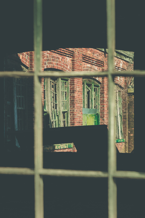 Details of the broken windows on an abandoned building in Fort Hancock at Sandy Hook Gateway National Recreation Area in New Jerseyの写真素材