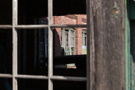 Details of the broken windows on an abandoned building in Fort Hancock at Sandy Hook Gateway National Recreation Area in New Jerseyの写真素材