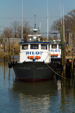 BELFORD, NEW JERSEY - April 11, 2017: Pilot boats are docked at the Belford Seafood Cooperativeのeditorial素材