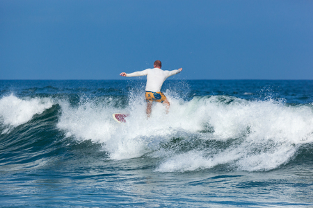 DEAL, NEW JERSEY - September 16, 2017: Surfers enjoy the  surfing the rough surf created by Tropical Storm Joseのeditorial素材
