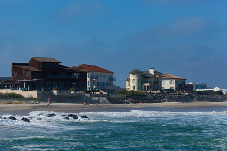 DEAL, NEW JERSEY - September 16, 2017: People enjoy one of the last days of summer in this seaside community. The surf is extra rough from Tropical Storm Jose.のeditorial素材