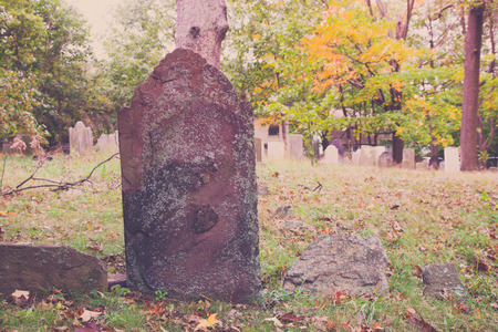 Old tombstones in a colonial cemetery in Metuchen, New Jersey. This cemetery predates the Revolutionary War.の写真素材