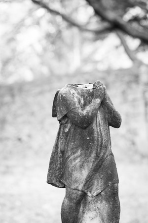 An old statue atop a grave has fallen apart at Rahway Cemeteryの写真素材