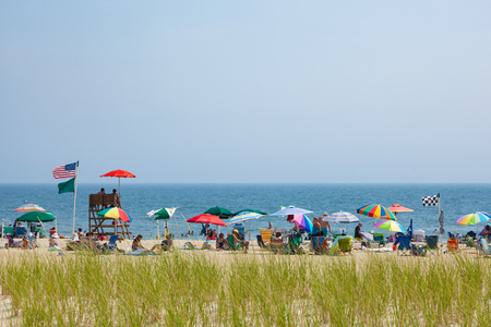 OCEAN GROVE, NEW JERSEY - August 22, 2017: People enjoy the beach on a sunny summer dayのeditorial素材