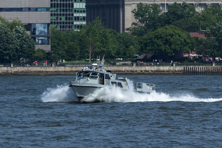 NEW YORK, NY - May 25, 2016: A New Jesey State Police boat patrols the Hudson River during the Parade of Ships, kicking off Fleet Week.のeditorial素材