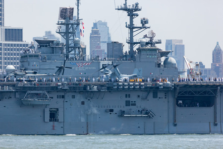 MAY 25, 2016 - Jersey City, NJ:  The USS Bataan Aircraft Carrier travels the Hudson River between Jersey City and Manhattan during the Parade of Ships for Fleet Week, 2016.のeditorial素材