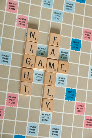 WOODBRIDGE, NEW JERSEY - October 9, 2018: A vintage Scrabble board game is shown with letter tiles spelling out Family Game Night.のeditorial素材