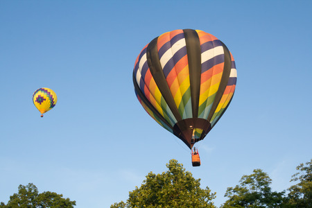 BRANCHBURG, NEW JERSEY - July 28, 2018: A hot air balloon gets ready to land near the Midland School after launching at the Quick Chek Festival of Ballooning.のeditorial素材