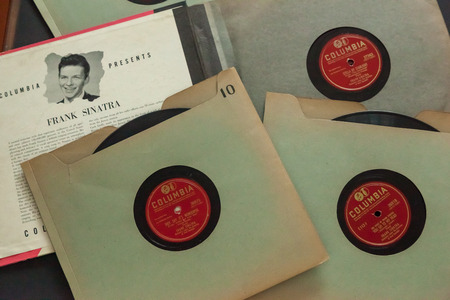 WOODBRIDGE, NEW JERSEY - October 11, 2018: 1940s era Frank Sinatra 78 RPM records on a black background.のeditorial素材