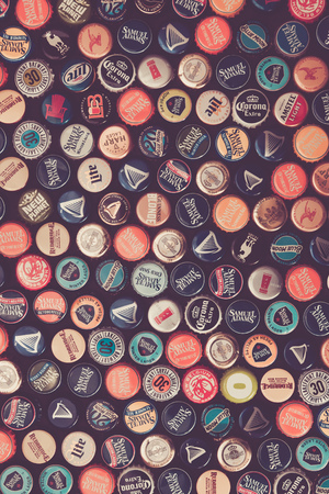 WOODBRIDGE, NEW JERSEY - October 13, 2018: A collection of colorful beer bottle caps of different brands is seenのeditorial素材