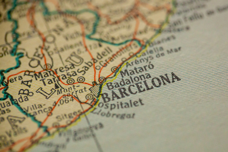 Barcelona, Spain is the center of focus on an old map.の写真素材