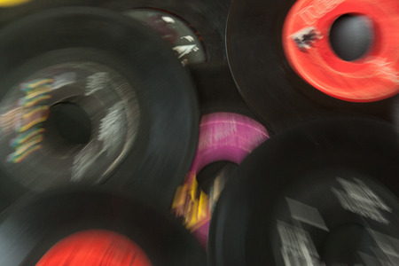 WOODBRIDGE, NEW JERSEY - October 11, 2018: A collection of 45 speed record albums, by various labels, done in an abstract blurのeditorial素材