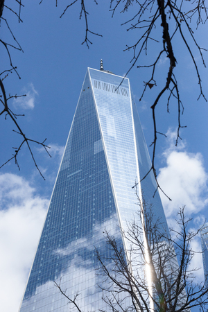 NEW YORK, NEW YORK - April 5, 2018: A unique view of the Freedom Tower, framed by barren tree branchesのeditorial素材