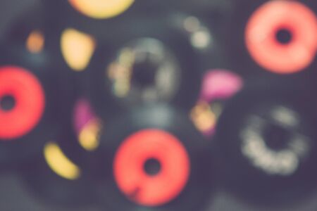 A pile of old 45 speed records, with a blur effect done in camera.の写真素材