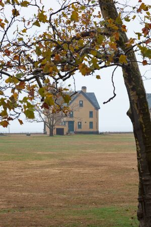 A view of the houses along Officers Row at Fort Hancock on a foggy autumn day. This is an inactive army military base on Sandy Hook, part of the Gateway National Recreation Area in New Jersey.の写真素材