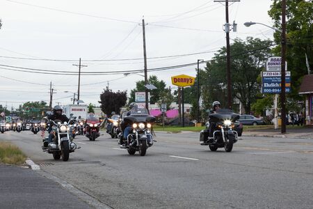 WOODBRIDGE, NEW JERSEY / USA - September 23, 2018: Motorcycles ride up Saint Georges Avenue for Rolling Thunder, supporting POW/MIA and military veteransのeditorial素材
