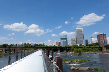 RICHMOND, VIRGINIA - August 8, 2019: a footbridge crosses the James River canal going to Brown's Islandのeditorial素材