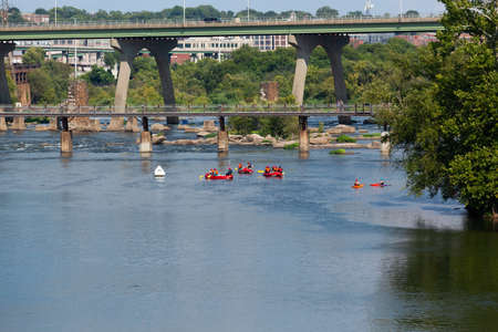 RICHMOND, VIRGINIA - August 8, 2019: a footbridge crosses the James River canal going to Brown's Islandのeditorial素材
