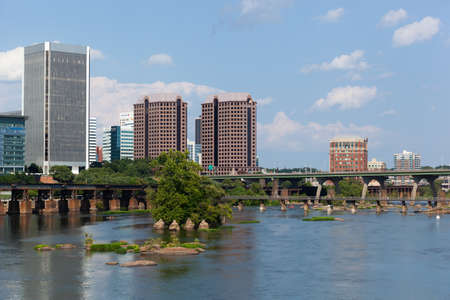 RICHMOND, VIRGINIA - August 9, 2019: The Richmond skyline is seen over the James River on a late summer dayのeditorial素材