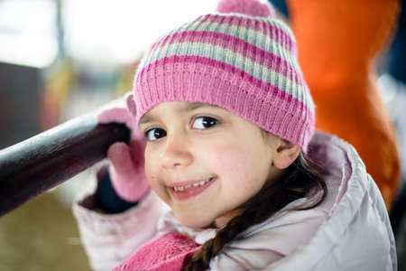 portrait of little girl with woolen cap and jacketの写真素材