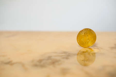 bitcoin on light marble electronic currency backgroundの写真素材